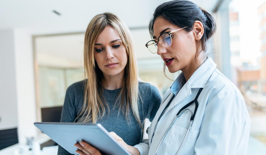 healthcare worker showing her tablet