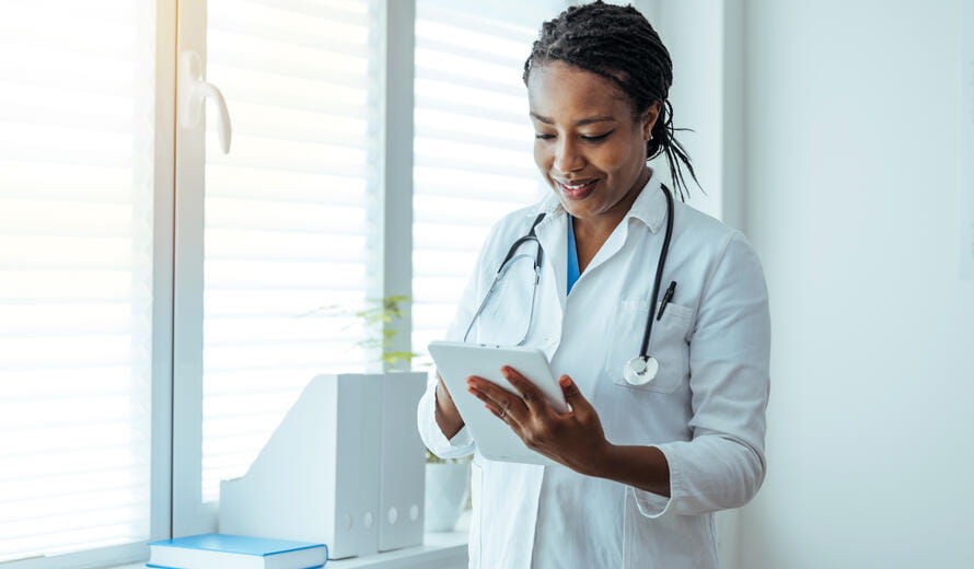 healthcare worker on a tablet