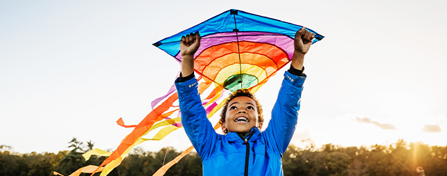 child flying a kite