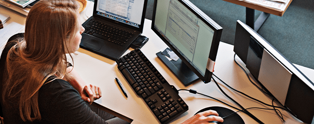 woman on 3 monitors