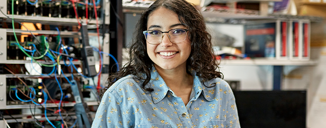 woman with glasses smiling