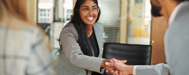 woman shaking a hand