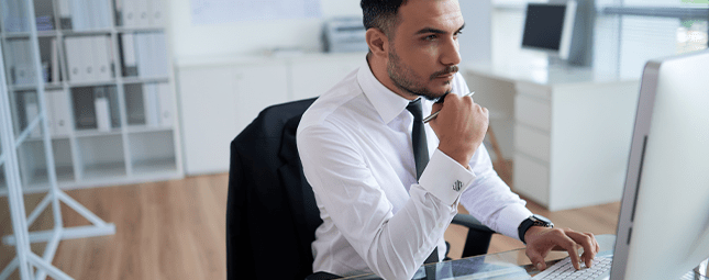 man looking at a computer